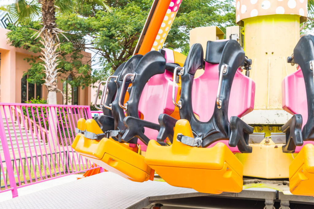 Colorful Roller Coaster Seats At Amusement Park